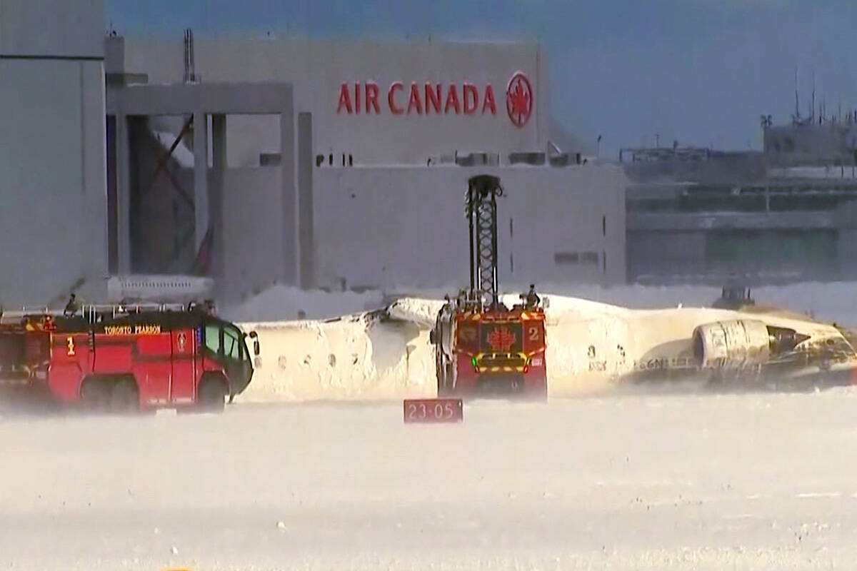 This image taken from video provided by CTV shows emergency crews responding at Toronto Pearson ...