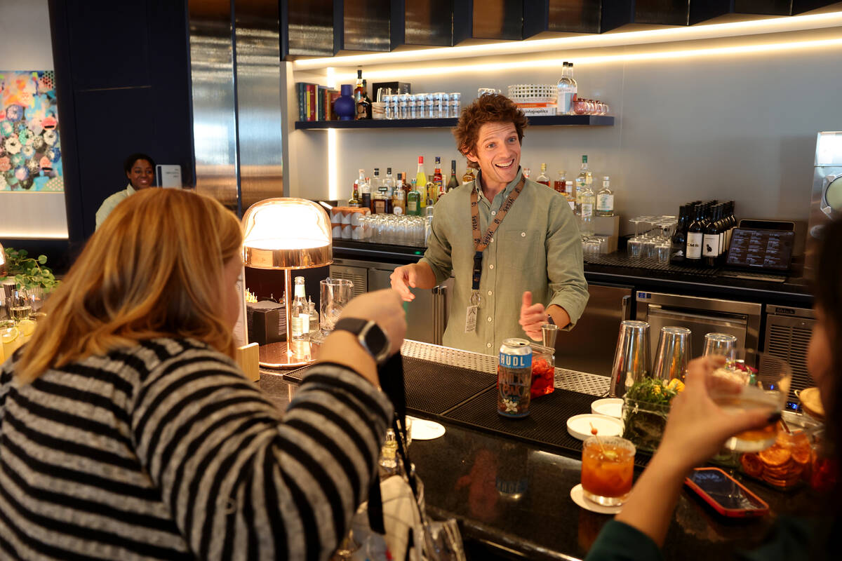 Gui Jaroschy, founder of Unfiltered Hospitality, visits with members of the media at the new Ca ...