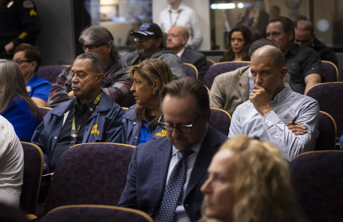 Supporters of embattled Henderson Police Chief Hollie Chadwick look on during a Henderson City ...