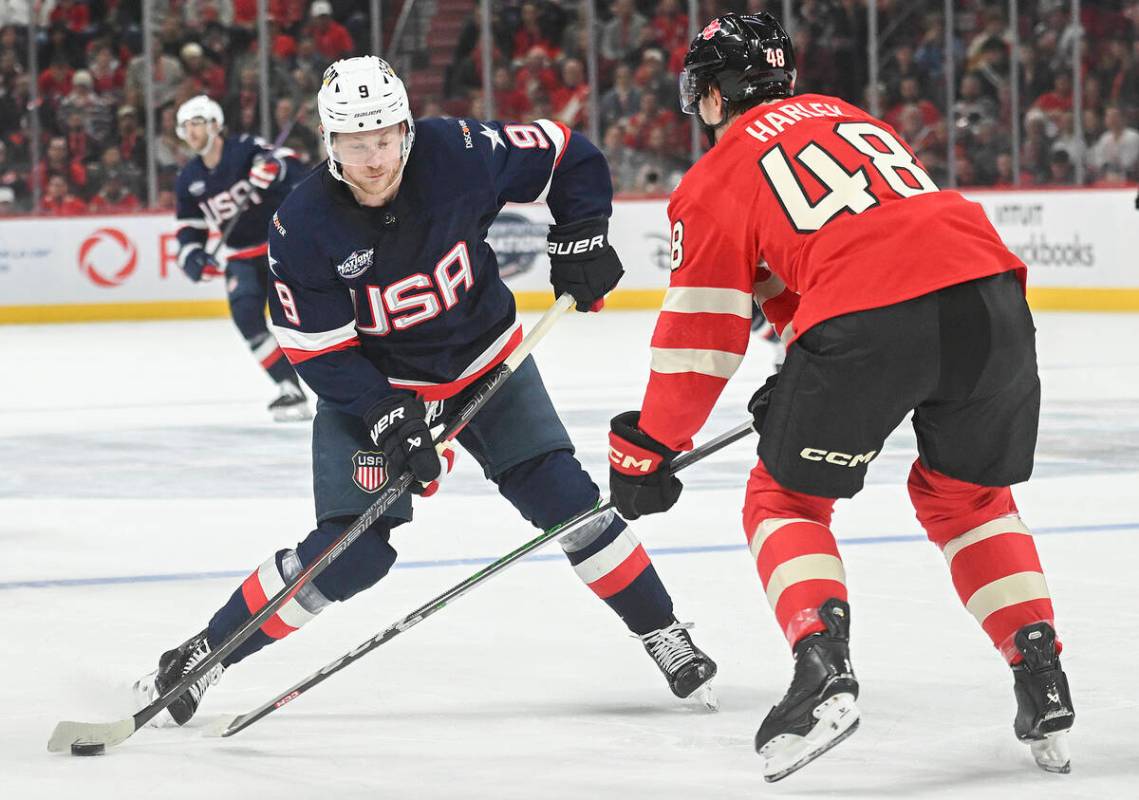 United States' Jack Eichel (9) takes a shot as Canada's Thomas Harley (48) defends during secon ...