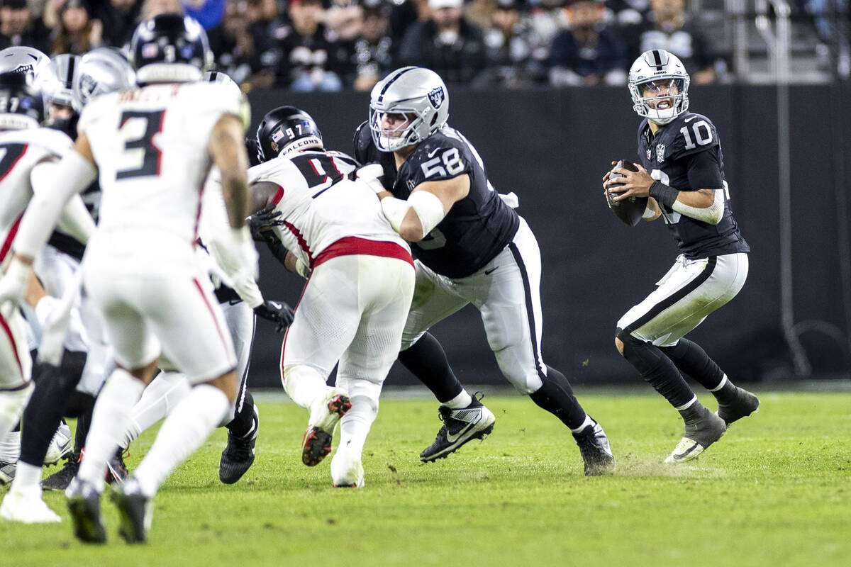Raiders quarterback Desmond Ridder (10) looks to throw the ball during the second half of the N ...
