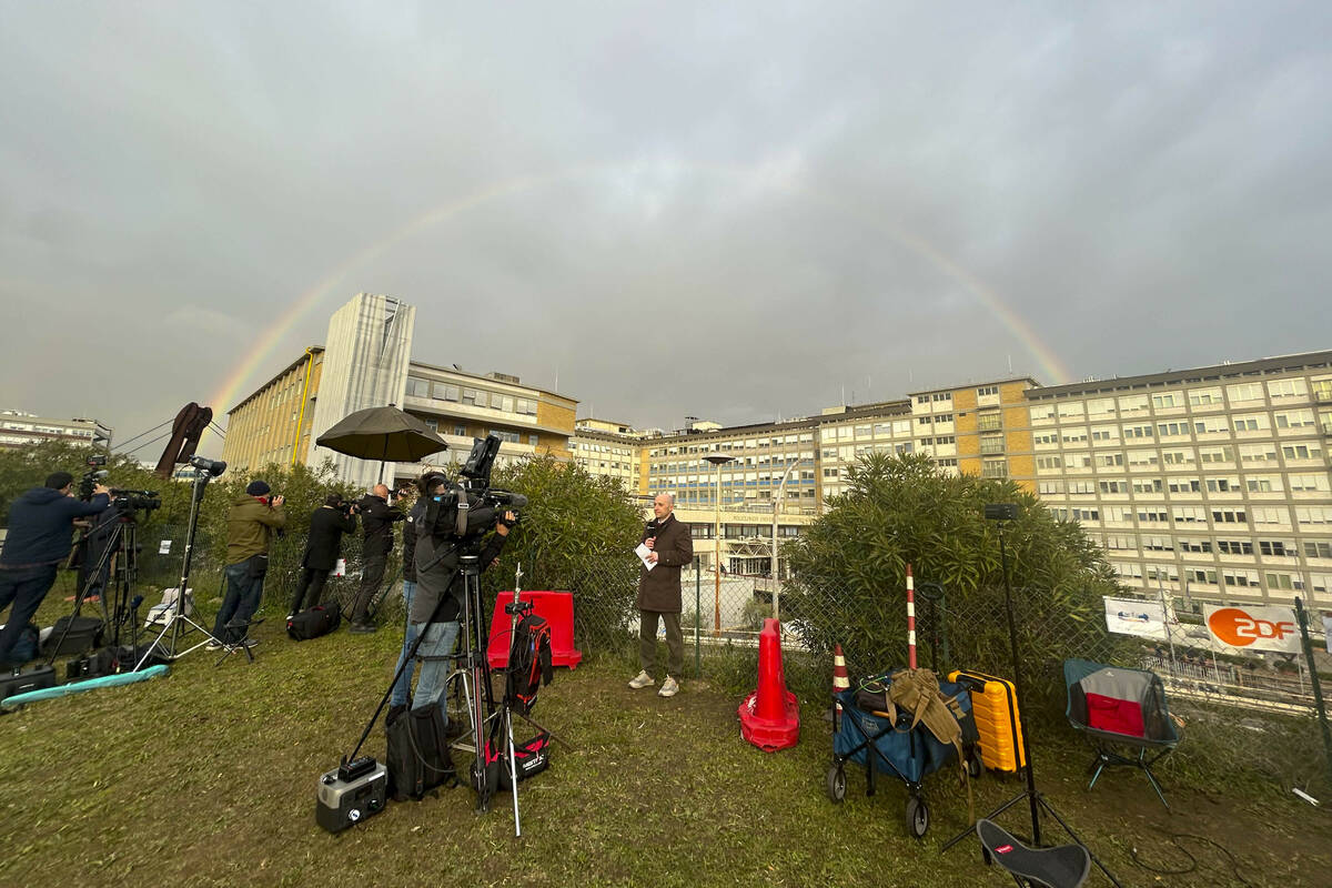 A rainbow shines over the Agostino Gemelli Polyclinic in Rome, Tuesday, Feb. 18, 2025, where Po ...
