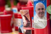 A candle with a portrait of Pope Francis is seen in front of the Agostino Gemelli Polyclinic, i ...