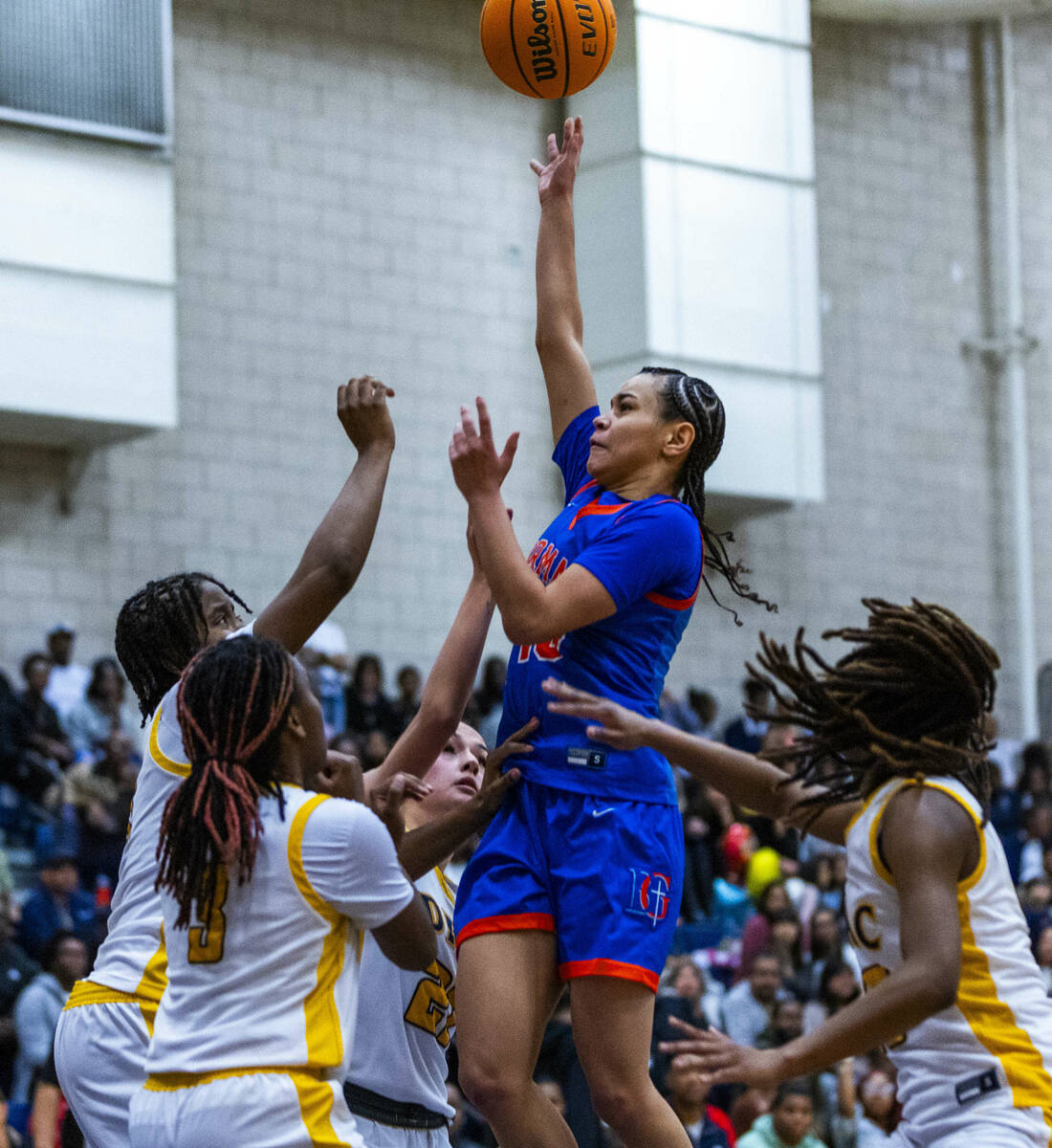 Bishop Gorman guard Aaliah Spaight (10) posts up for a shot over Democracy Prep defenders durin ...