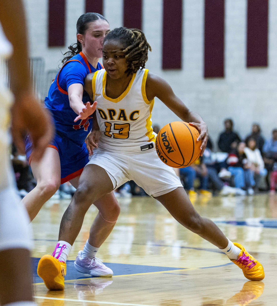 Democracy Prep's Keonni Lewis (13) drives during the second half of their girls basketball game ...