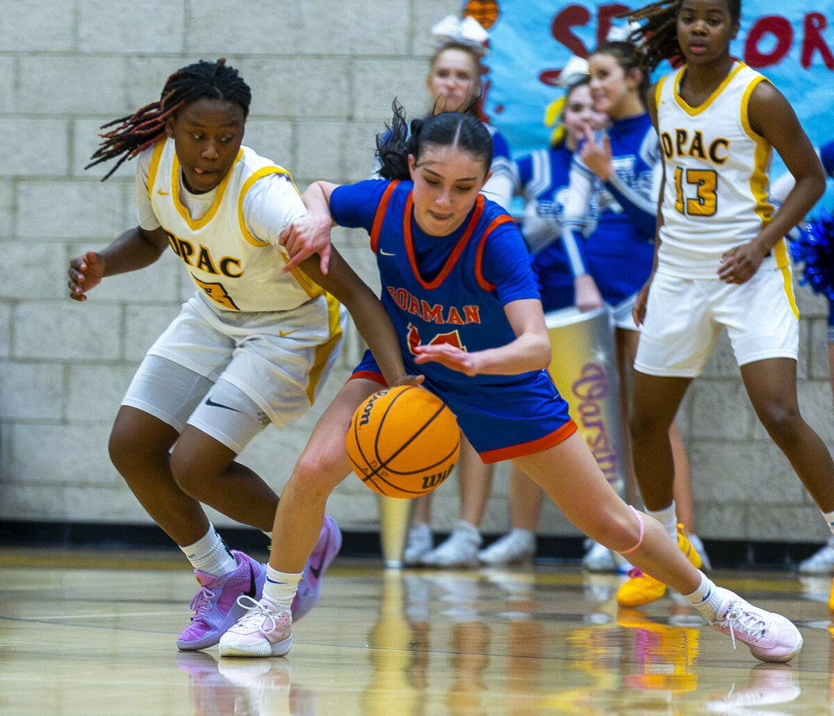 Democracy Prep guard Bray'ana Miles (3) attempts to steal the ball from Bishop Gorman guard Ken ...
