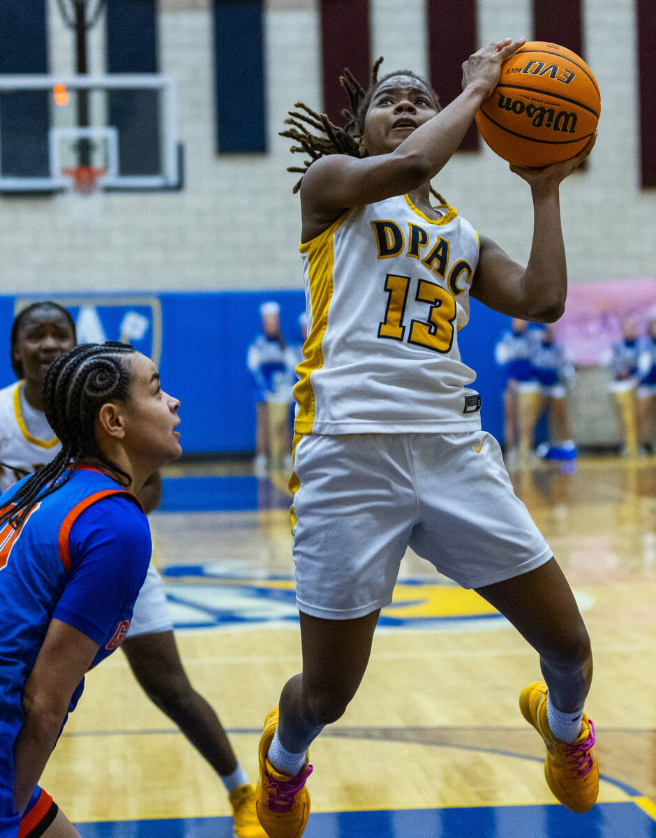 Democracy Prep guard Keonni Lewis (13) elevates for a shot over Bishop Gorman guard Aaliah Spai ...