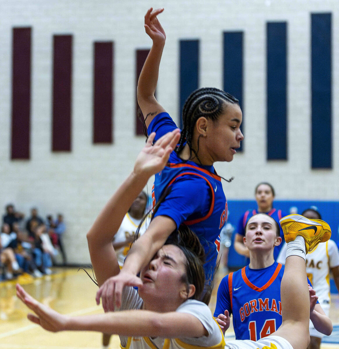 Democracy Prep guard Ella Smith (21) is crushed by Bishop Gorman guard Aaliah Spaight (10) comi ...