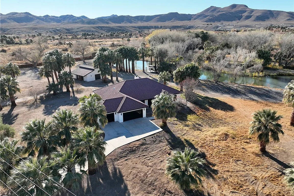 Located in Moapa at 4255 West State Highway 168, this equestrian facility includes two homes, a ...