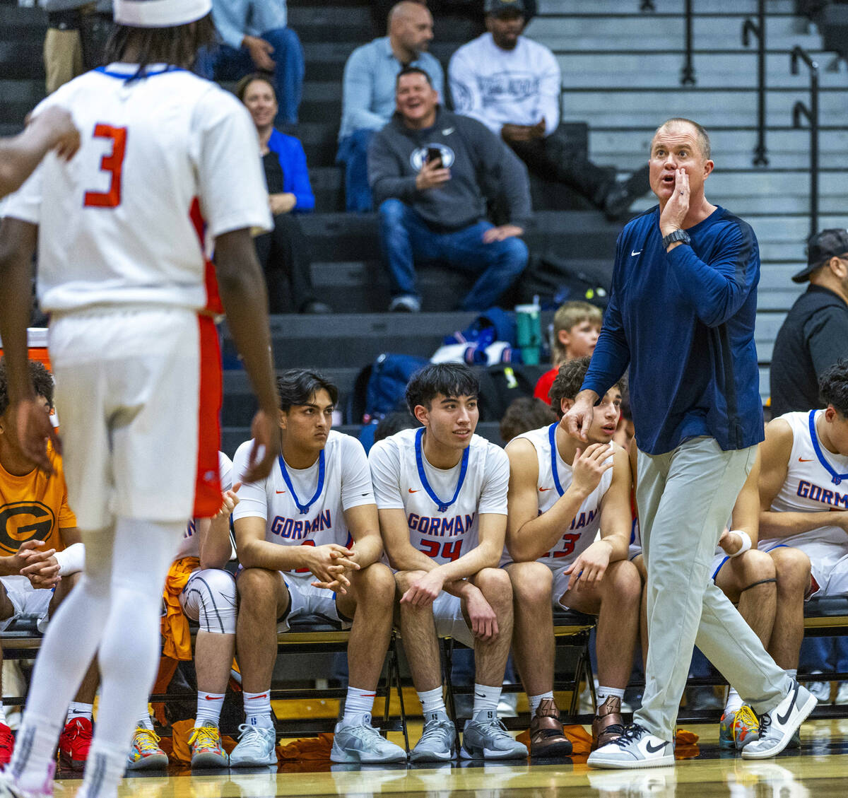 Bishop Gorman head coach Grant Rice sends a message to guard Ty Johnson (3) against Desert Pine ...