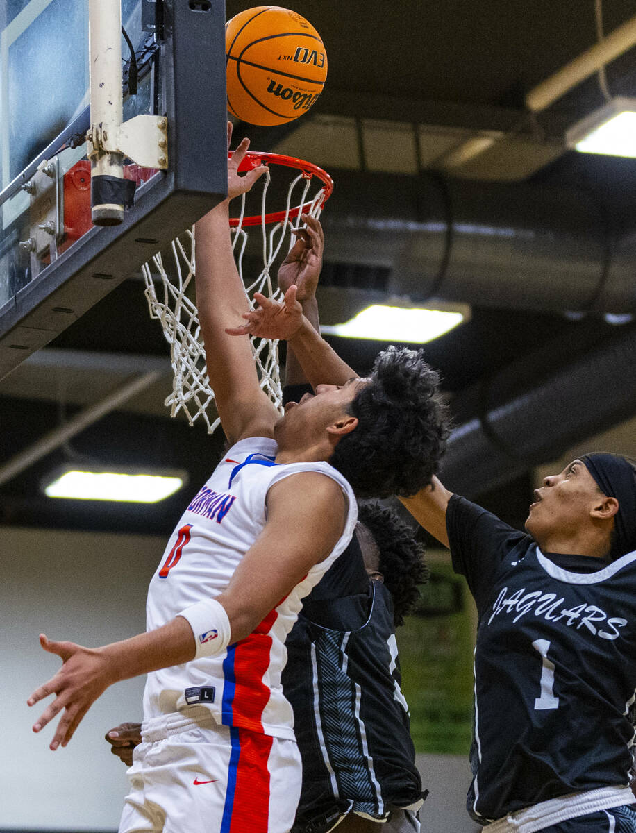 Bishop Gorman forward Kingston Carmona (0) lays the ball in over Desert Pines guard Jaden Reddi ...