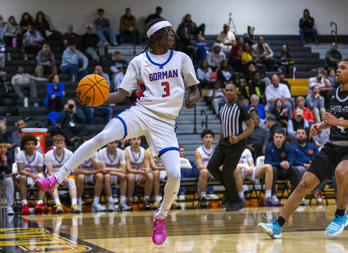 Bishop Gorman guard Ty Johnson (3) saves a long pass as during the second half of their 5A boys ...