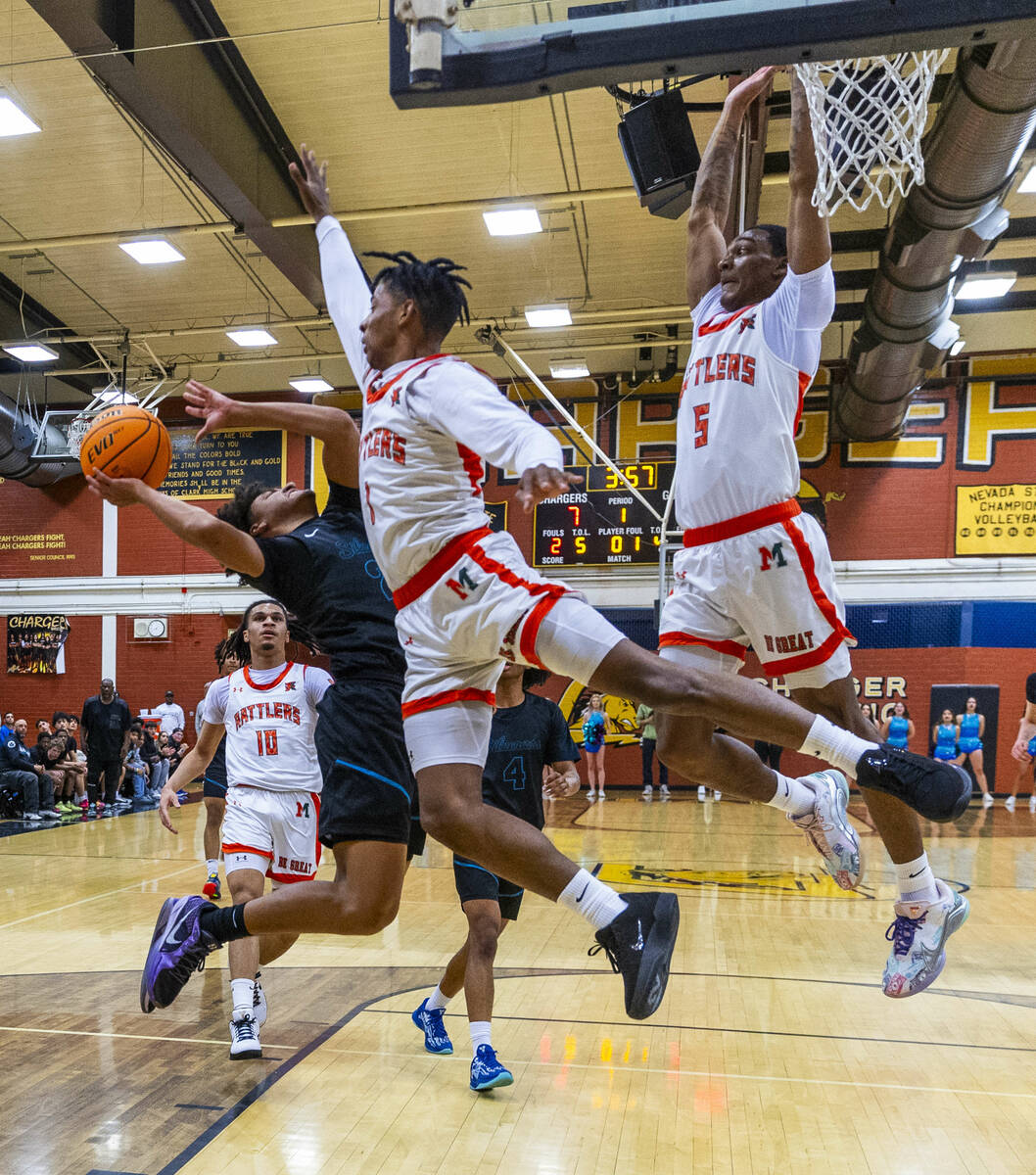 Silverado guard TraVaughn Jensen Brigance (23) attempts to shoot over Mojave guard Zacarrion Ja ...
