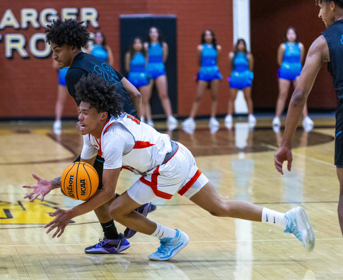 Mojave guard Jordan Lewis (40) is fouled by Silverado guard TraVaughn Jensen Brigance (23) duri ...