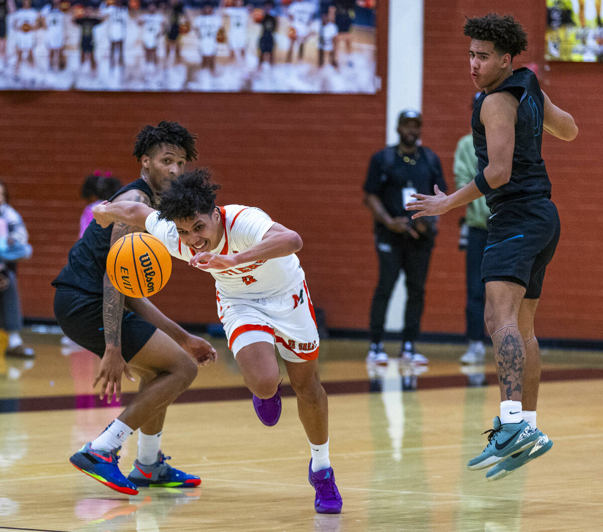 Mojave guard Jayden Luna (0) eyes the ball poked away by Silverado forward Travis Fralin (13) d ...