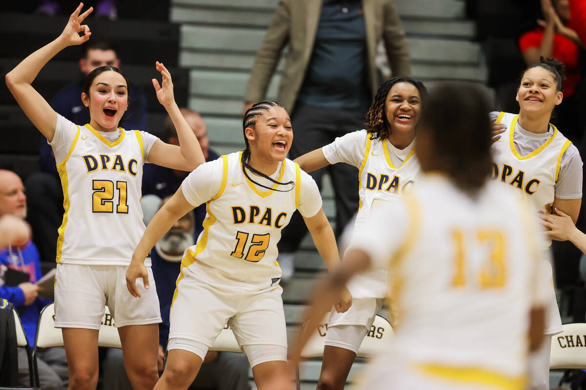Democracy Prep players celebrate from the bench during a Class 5A girls basketball state semifi ...