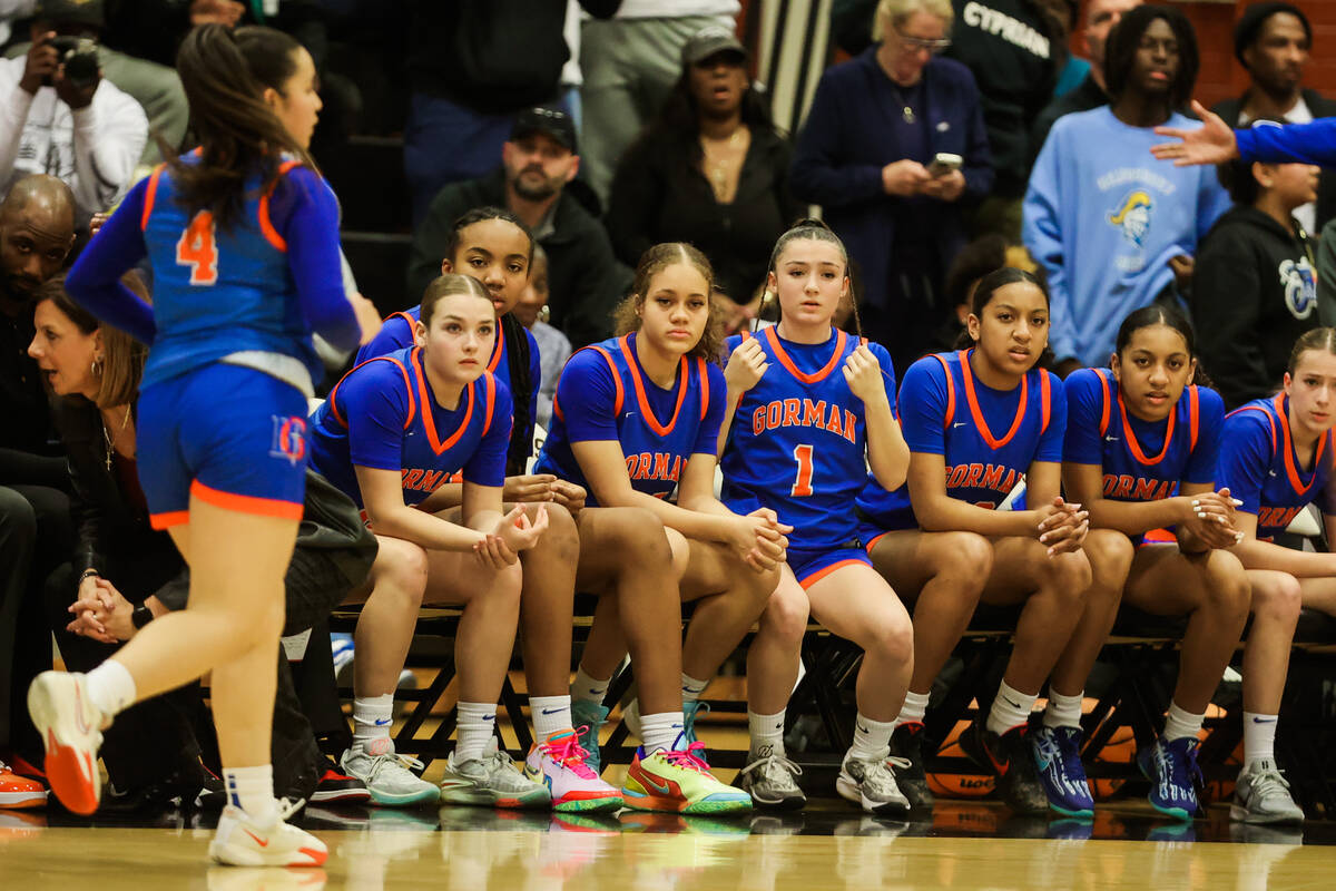 Bishop Gorman players react to being down against Democracy Prep in overtime during a Class 5A ...