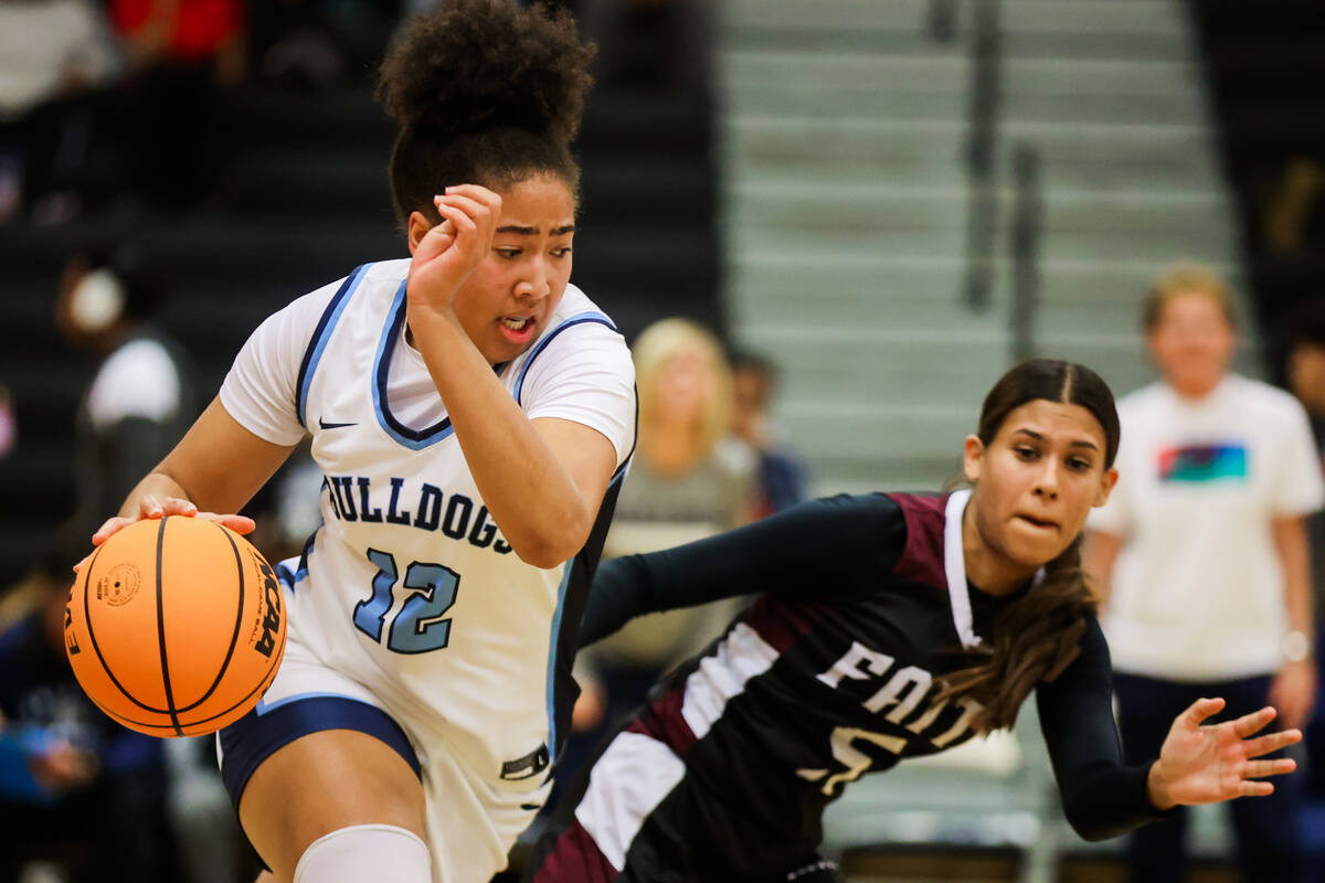 Centennial forward Ayla Williams (12) dribbles the ball during a class 5A girls basketball stat ...