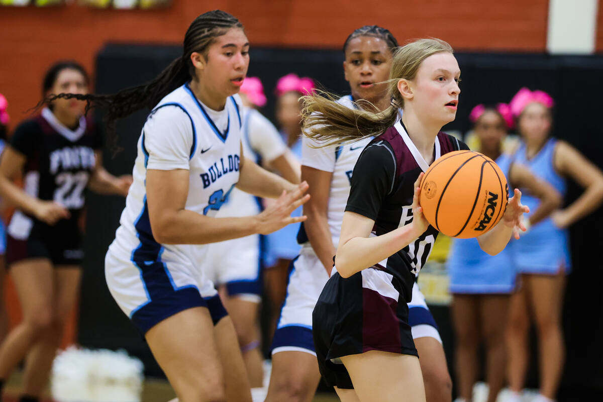 Faith Lutheran forward Karly Schneider (10) passes the ball during a class 5A girls basketball ...