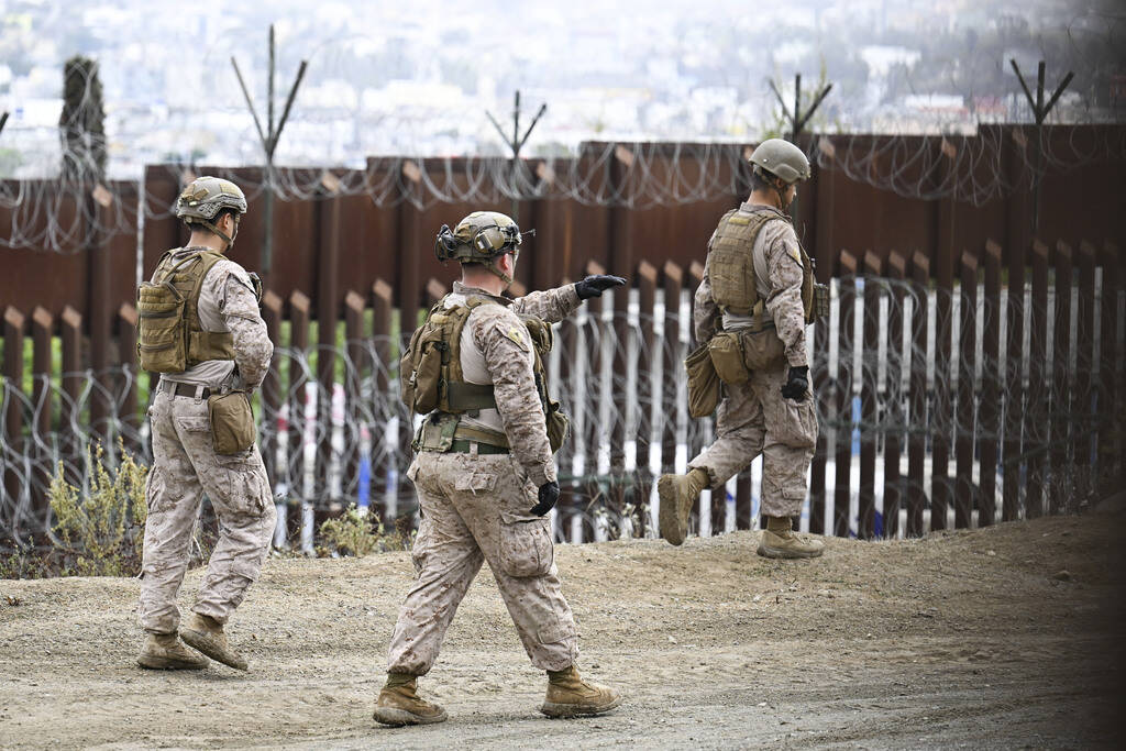 U.S. Marines deploy along the U.S.-Mexico border near the San Ysidro Port of Entry, Friday, Feb ...