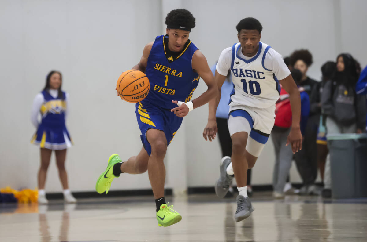 Sierra Vista guard Jevon Yapi (1) drives to the ball under pressure from Basic guard Kelani Sta ...