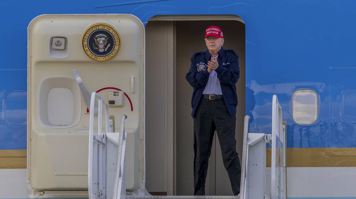President Donald Trump reacts as he arrives on Air Force One at Miami International Airport, We ...