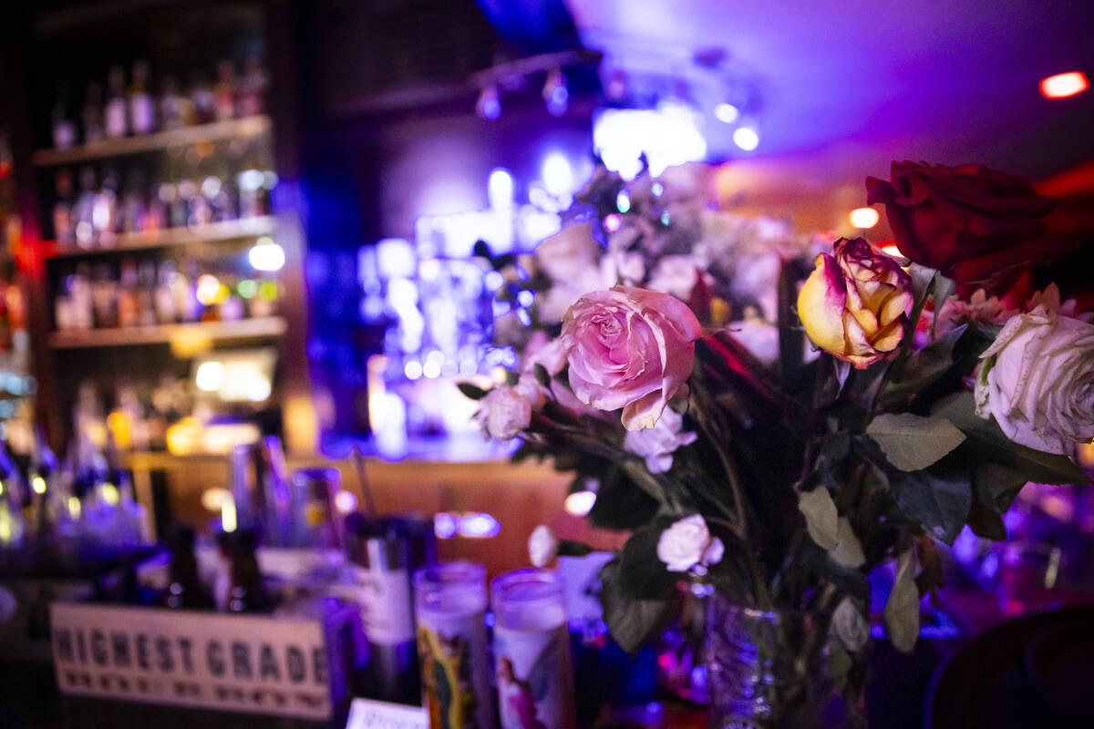Floral arrangements and candles from nearby businesses that were left in memory of Hope Ritter, ...