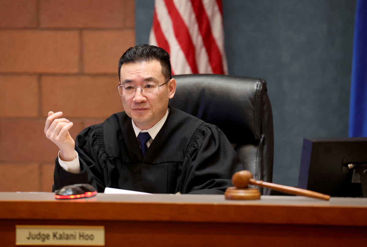 Justice of the Peace Kalani Hoo presides during a court hearing for six suspects facing a murde ...