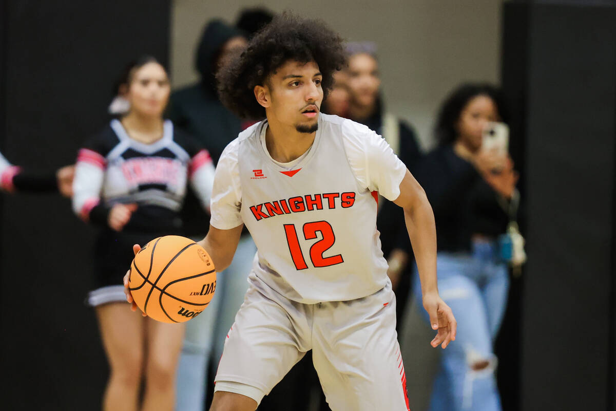 Mater East shooting guard Kobe Robinson (12) dribbles the ball during a class 3A semifinals bas ...