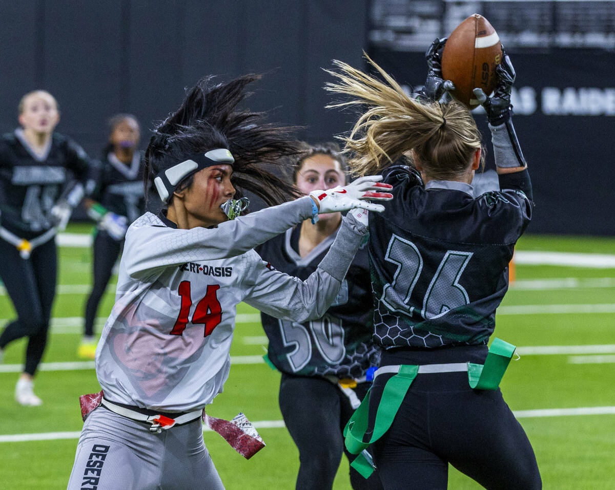 Palo Verde defensive back Samantha Manzo (26) intercepts a pass intended for Desert Oasis wide ...