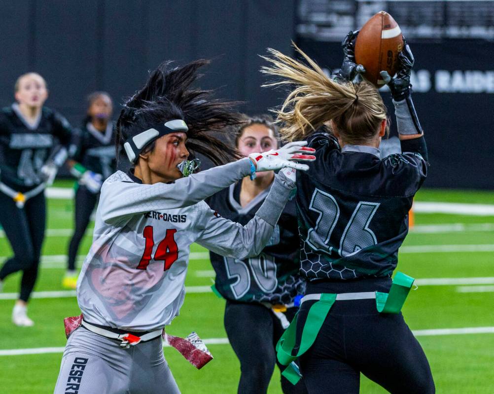 Palo Verde defensive back Samantha Manzo (26) intercepts a pass intended for Desert Oasis wide ...