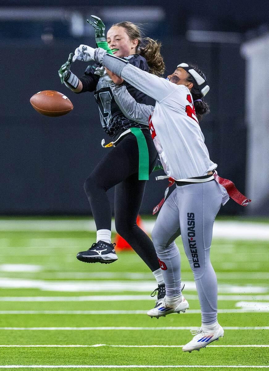 Palo Verde wide receiver Alexis Manzo (15) has the ball knocked away by Desert Oasis defensive ...