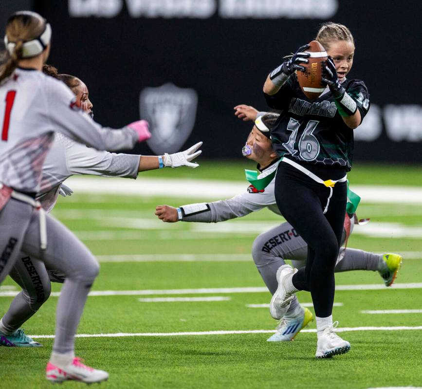 Palo Verde running back Samantha Manzo (26) evades a flag pull on a run by Desert Oasis defensi ...