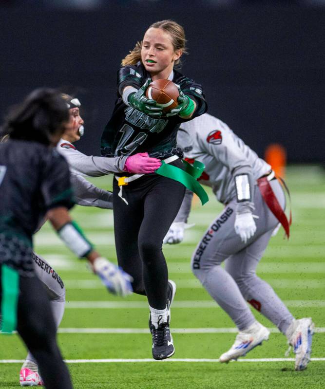 Palo Verde running back Samantha Manzo (26) evades a flag pull on a run by a Desert Oasis defen ...