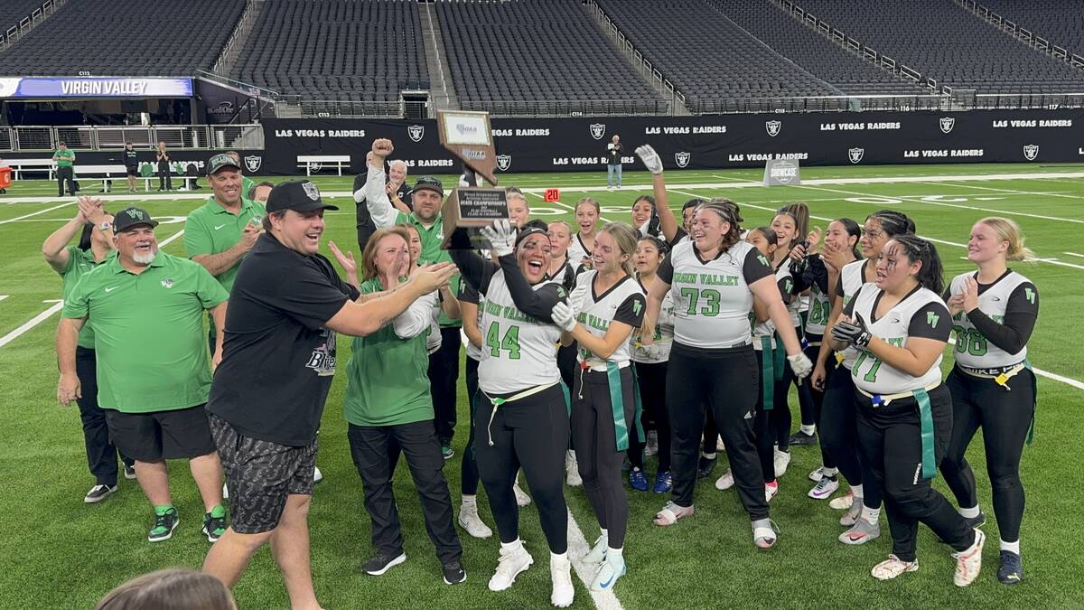 Raiders offensive lineman Jackson Powers-Johnson hands the Class 3A flag football state champio ...