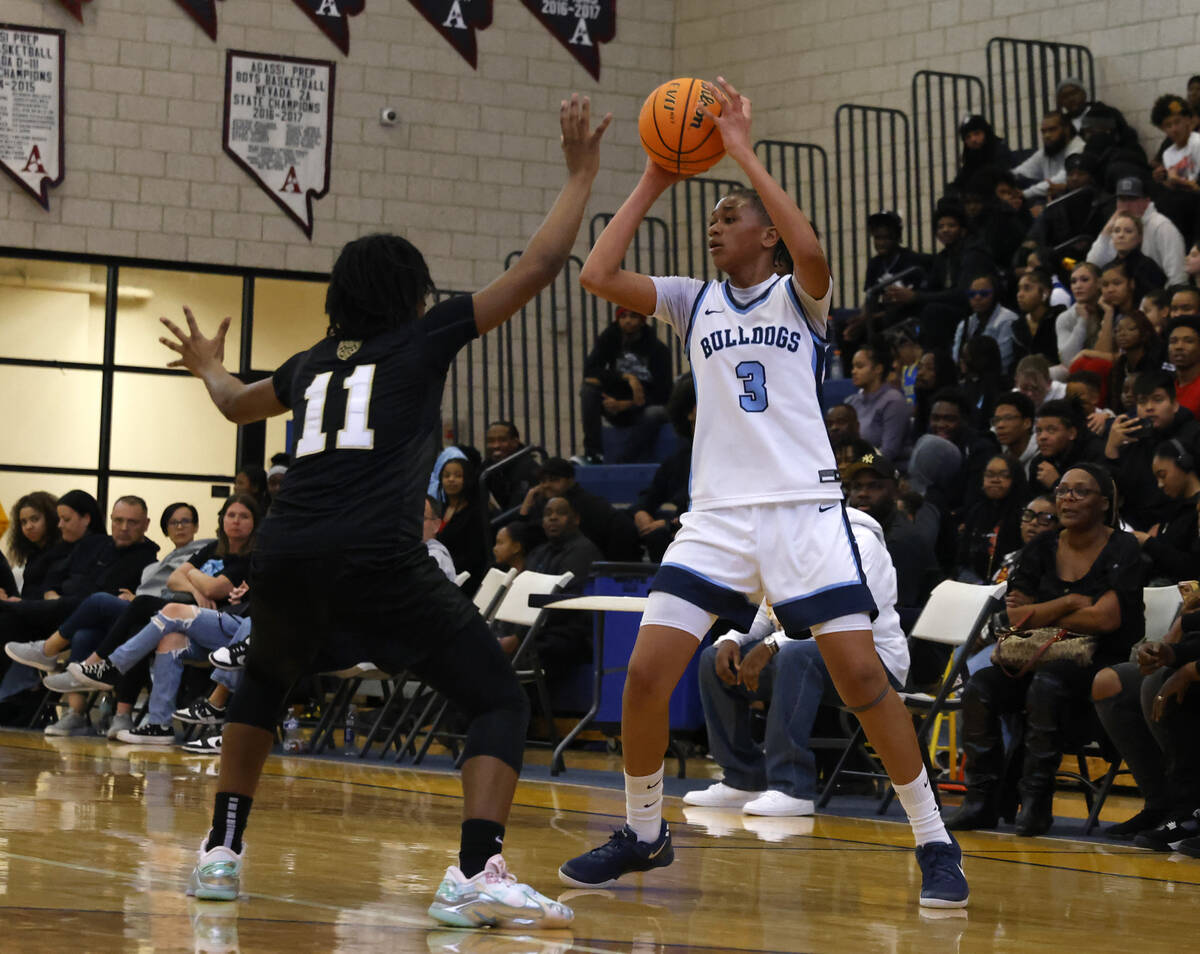 Centennial's D'Arrah Mitchell (3) looks to pass the ball as Democracy Prep's La'Niah Hicks (11) ...