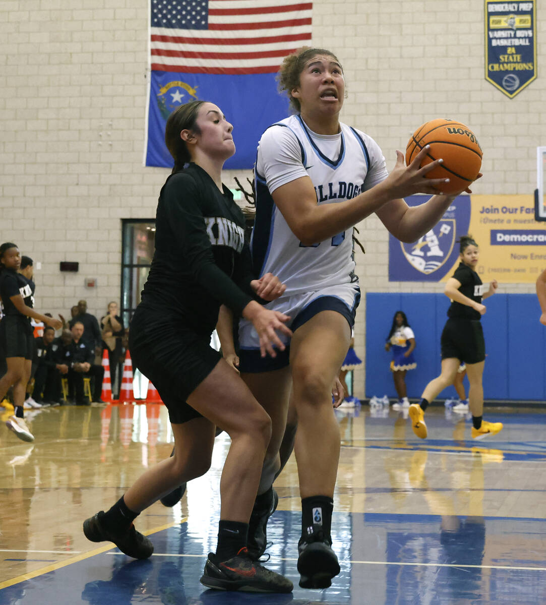 Centennial's Nation Williams (24) looks to score past Democracy Prep's Madison Smith (1) during ...