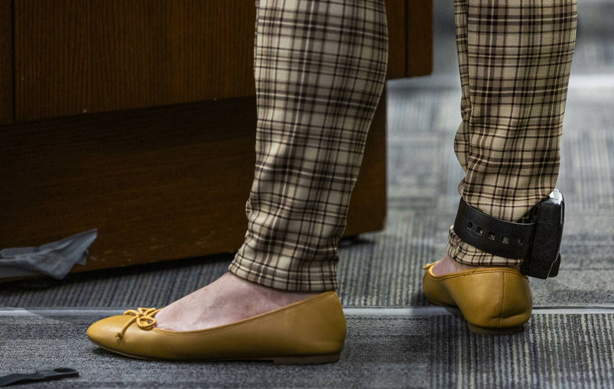 A participant wears an ankle monitor while making an appearance in adult drug court before Hear ...
