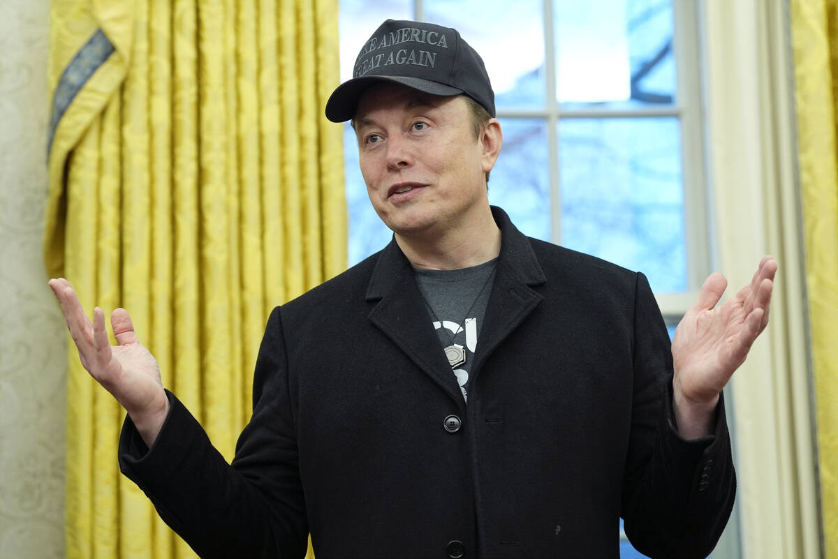 Elon Musk speaks during an event with President Donald Trump in the Oval Office at the White Ho ...