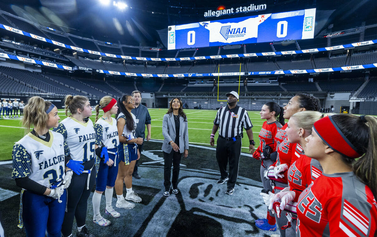 Raiders President Sandra Douglass Morgan conducts a coin toss for Arbor View and Foothill for t ...