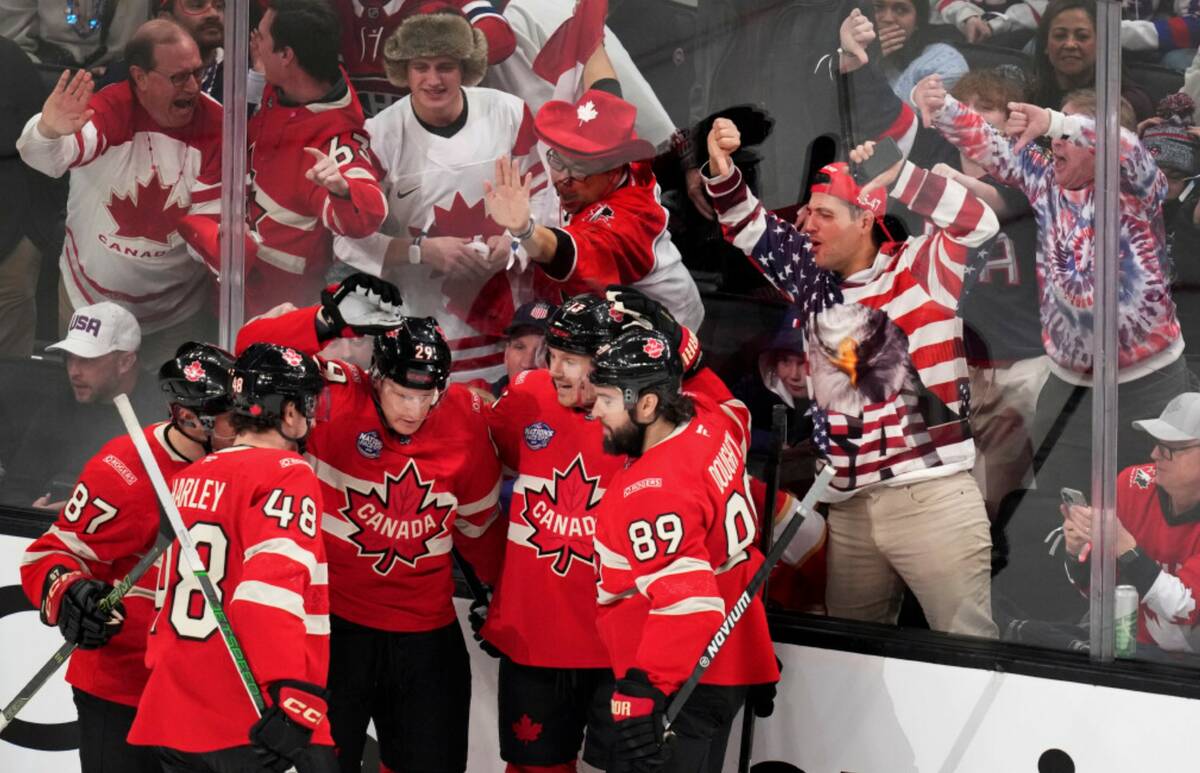 Canada players celebrate after a goal by Nathan MacKinnon during the first period of the 4 Nati ...