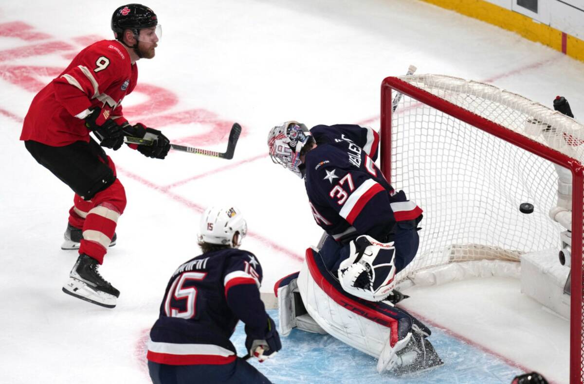 Canada's Sam Bennett (9) scores on United States goalie Connor Hellebuyck during the second per ...