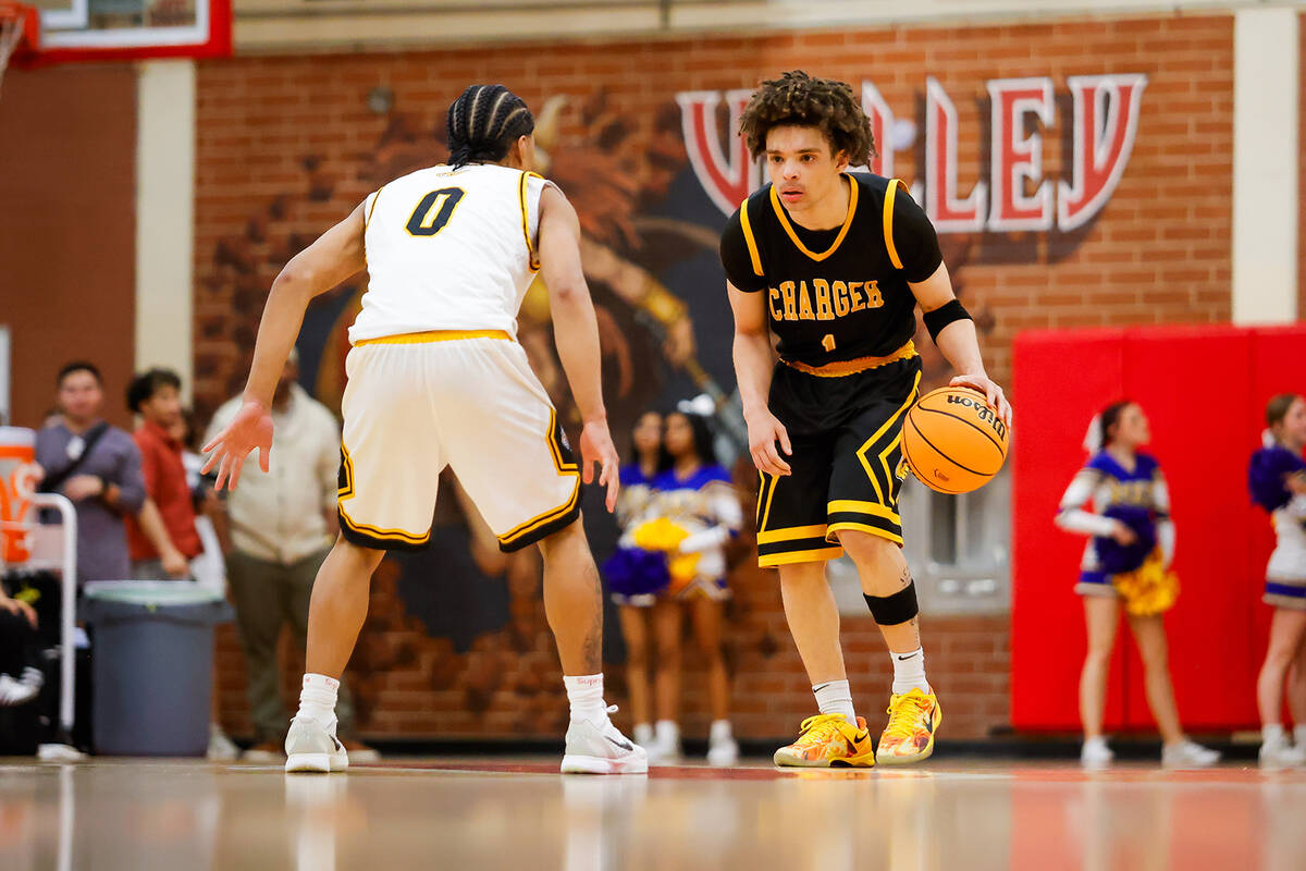 Clark point guard Amir Wright (1) dribbles the ball up the court during a Class 4A boys basketb ...