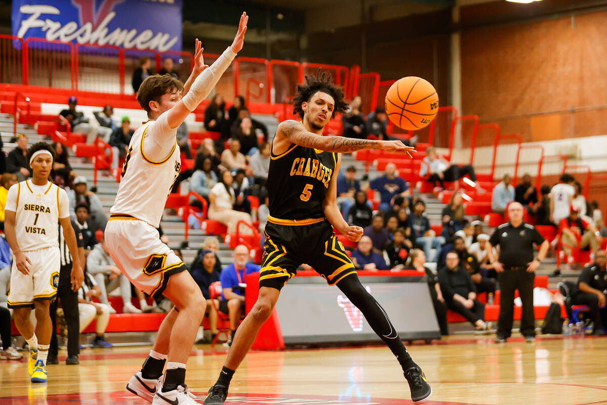 Clark power forward Michael Gebremeskel (5) passes the ball out to the perimeter during a Class ...