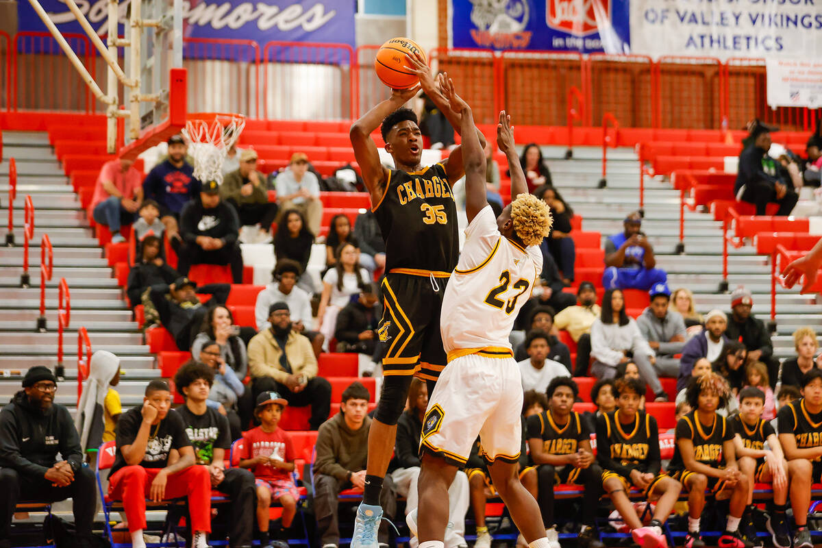 Clark power forward Devan Christion (35) shoots a fadeaway shot during a Class 4A boys basketba ...