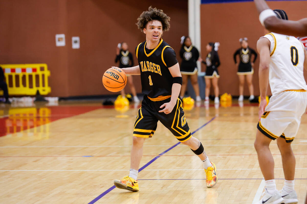 Clark point guard Amir Wright (1) looks to create a play during a Class 4A boys basketball stat ...