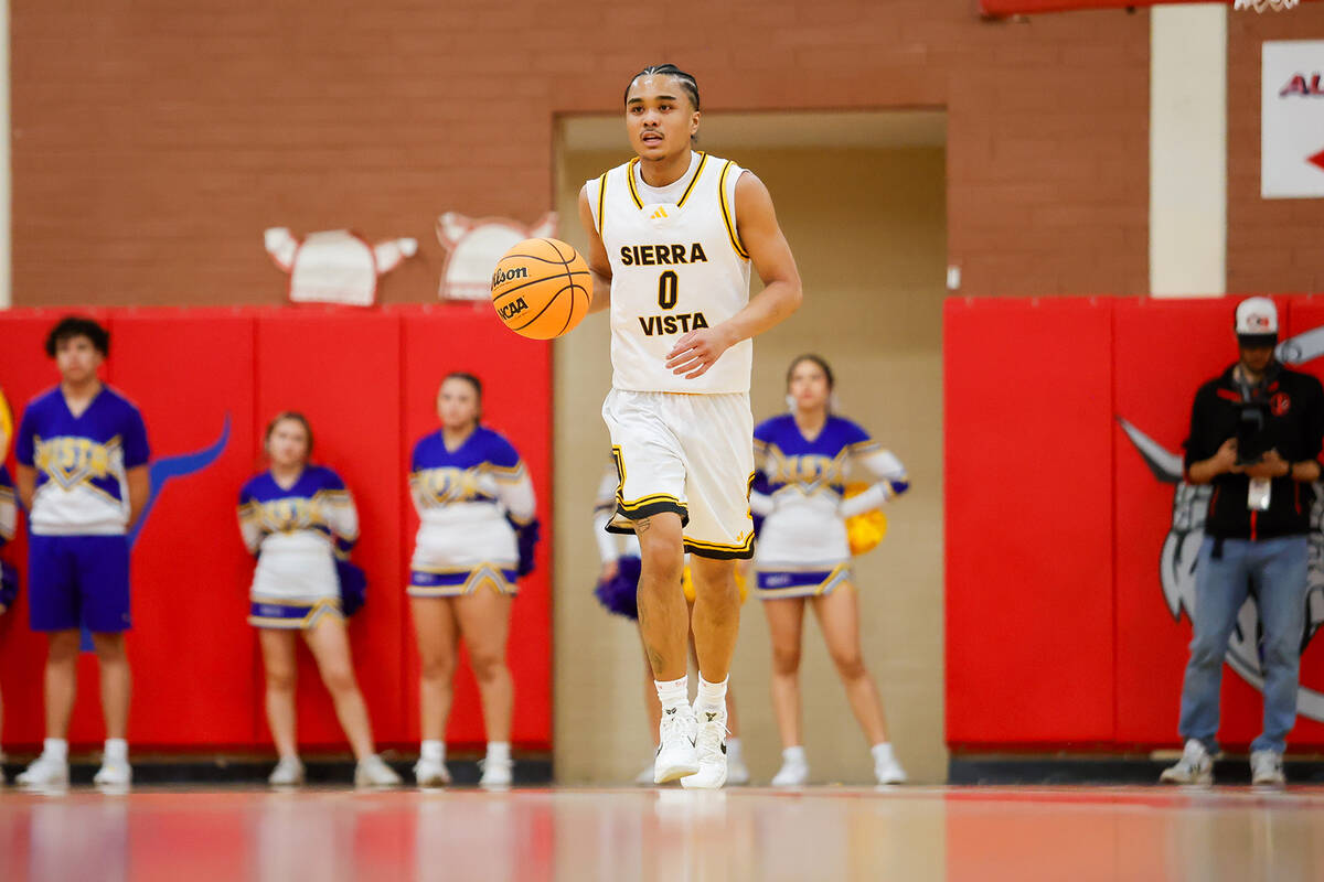 Sierra Vista point guard EJ Dacuma (0) dribbles the ball up the court during a Class 4A boys ba ...