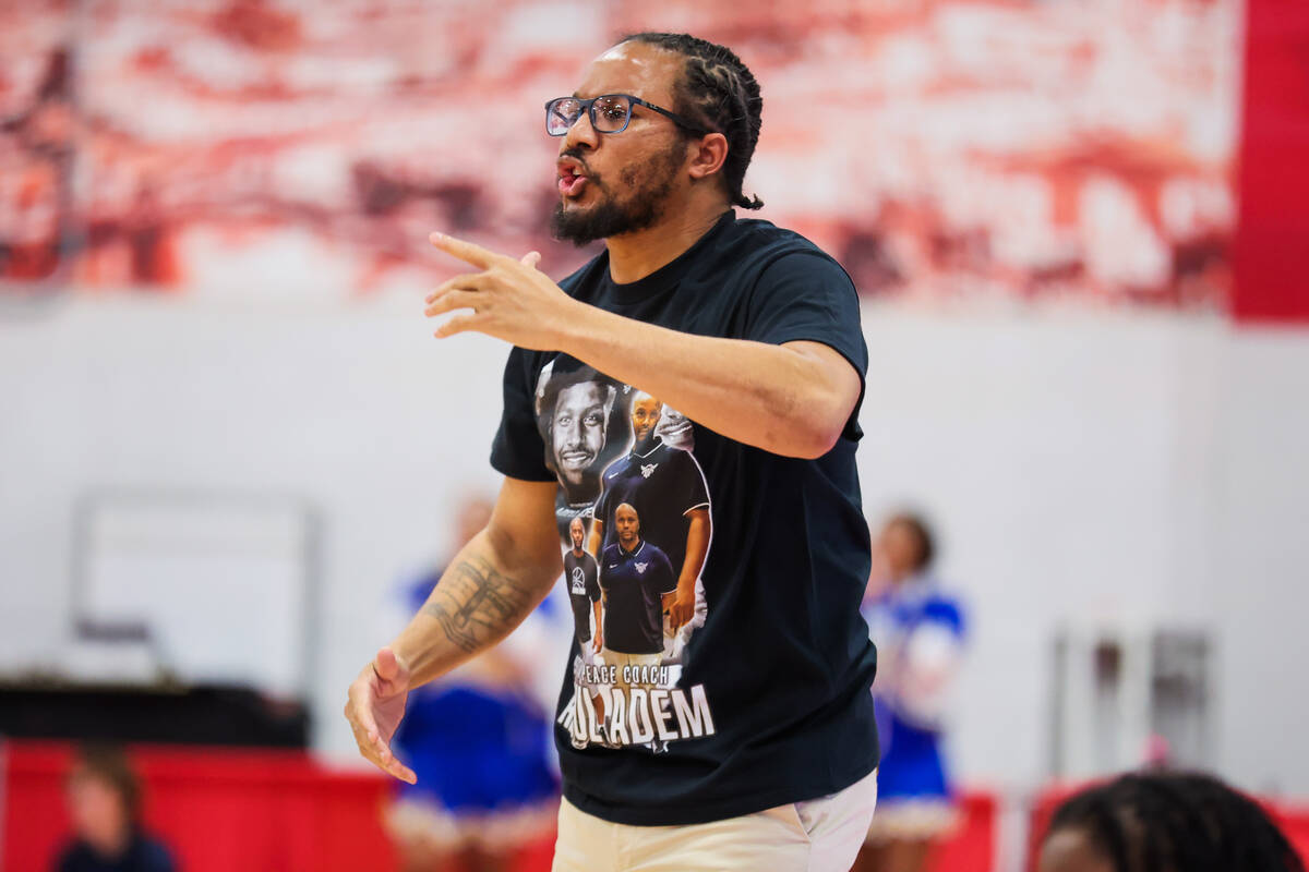 Democracy Prep head coach Julius Barren coaches from the sidelines during a class 5A girls bask ...