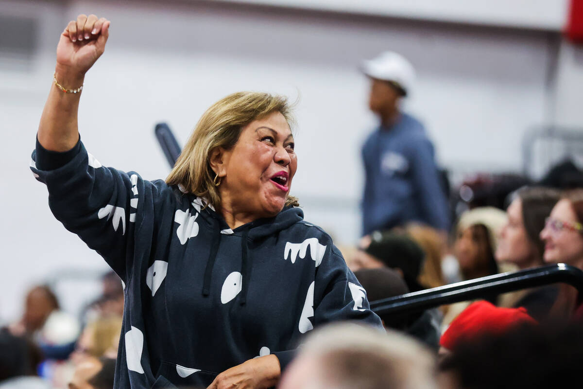 A Centennial fan cheers during a class 5A girls basketball state championship game between Cent ...