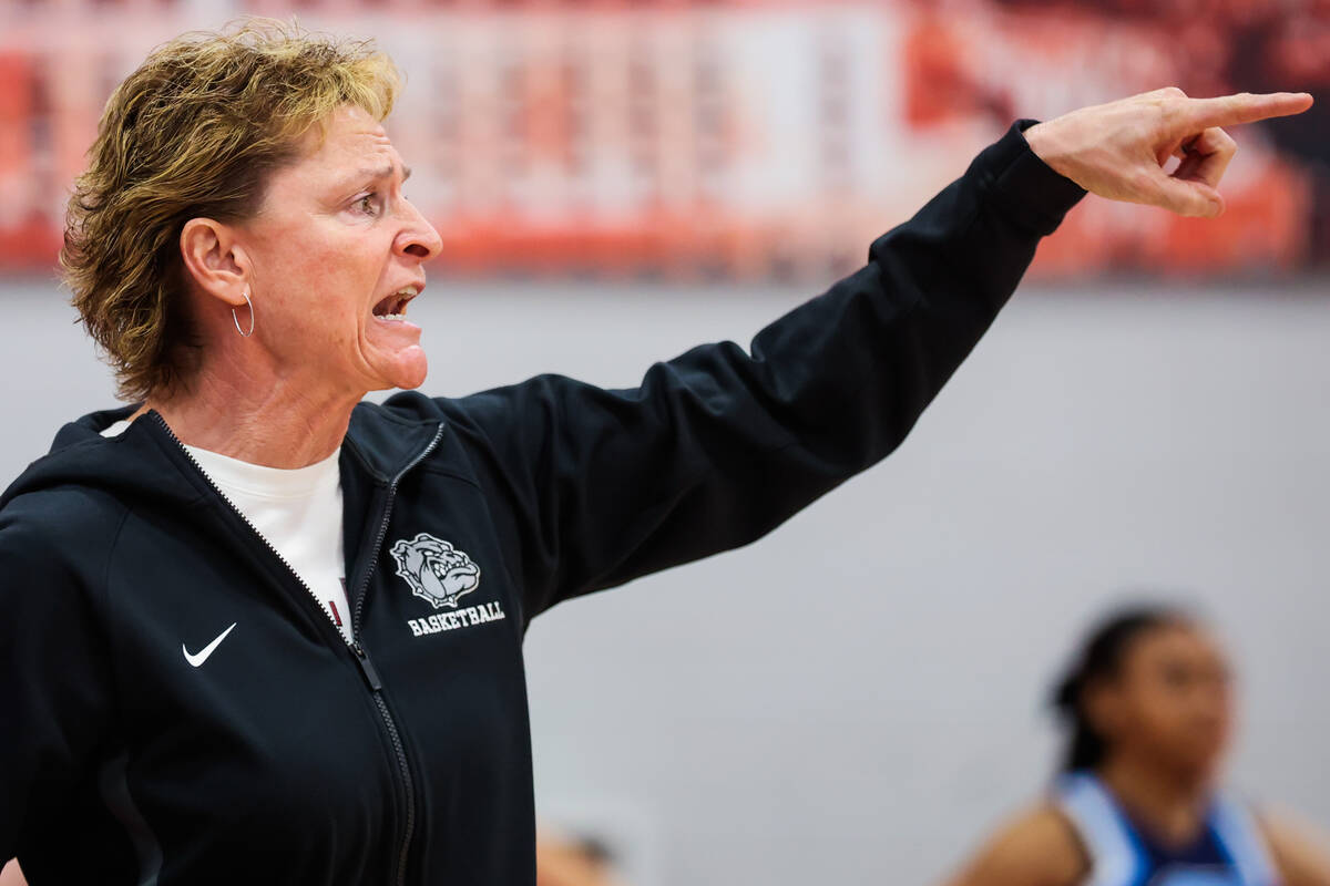 Centennial head coach Karen Weitz coaches from the sidelines during a class 5A girls basketball ...